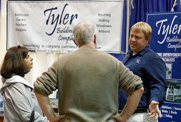 people talking with a tyler building company associate